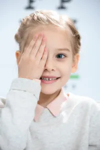 smiling-little-kid-closing-